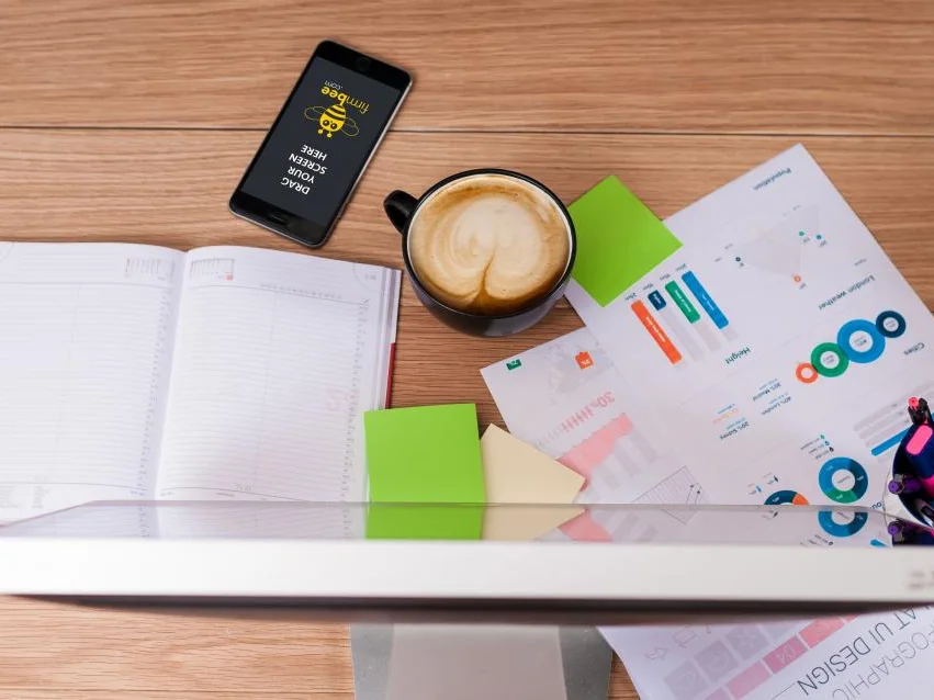 Marketing plan flat lay with charts, phone and notebook