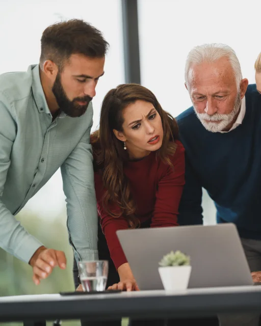 Designers and developers reviewing work together