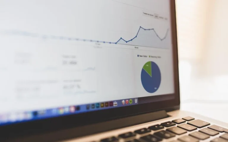 Laptop showing a business growth chart